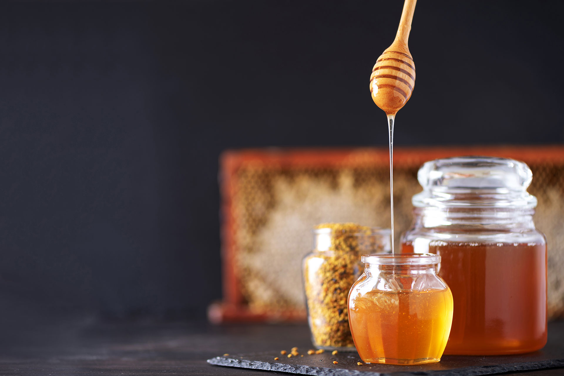 bee pollen granules honey jar with wooden dropper 2021 08 26 20 11 16 38XBNCZ